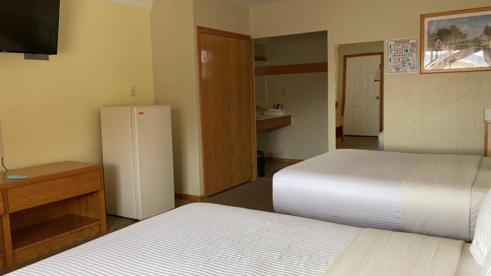 La Huerta Inn & Suites Cuauhtémoc Quarto foto